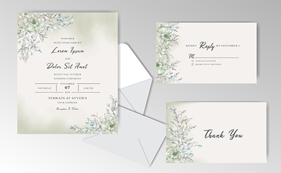 Wedding invitation set with green floral design, including RSVP and thank-you cards, displayed with envelopes.